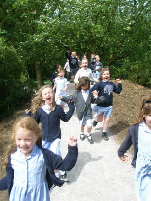 group of happy schoolchildren