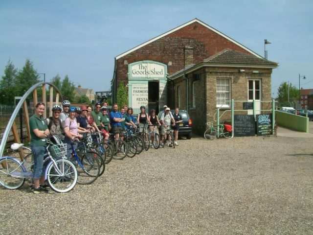 summer cyclists in front of Goods Shed , Canterbury