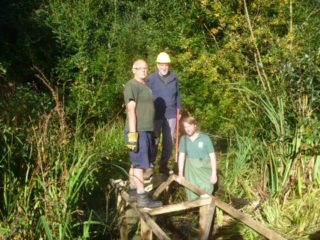 Volunteers working on boardwalk at Bus Company Island