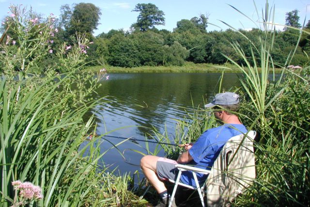 Angler by lake