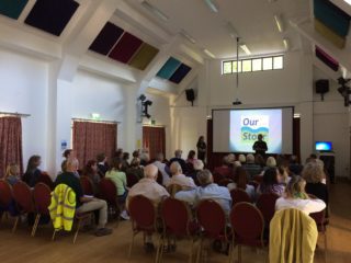 speaker with presentation at Our Stour opening event