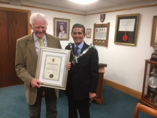 Mr Brian Sandall reveing certificate from Mayor Ashford