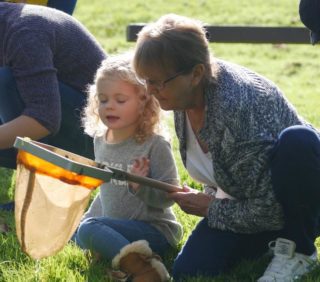 woman & small child with net