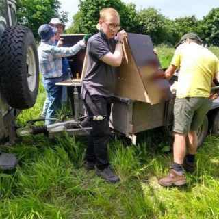 volunteers assembling barn owl boxes