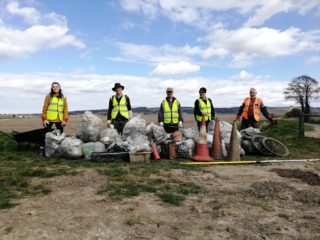 volunteers and bags of litter collected