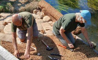volunteers fixing matting
